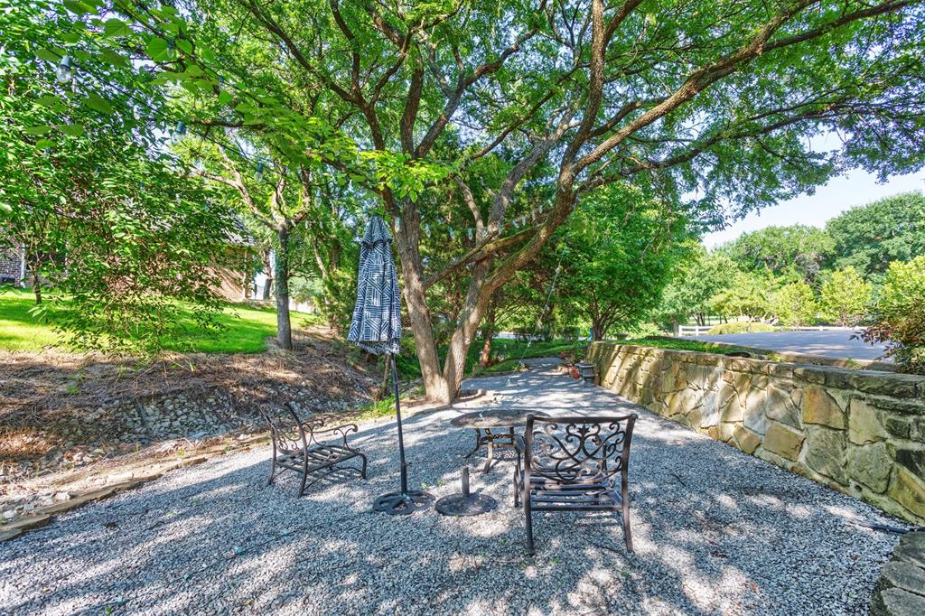 3401 Francesca Court Rowlett, TX 75088 - Photo 12 of 13 a backyard of a house with table and chairs