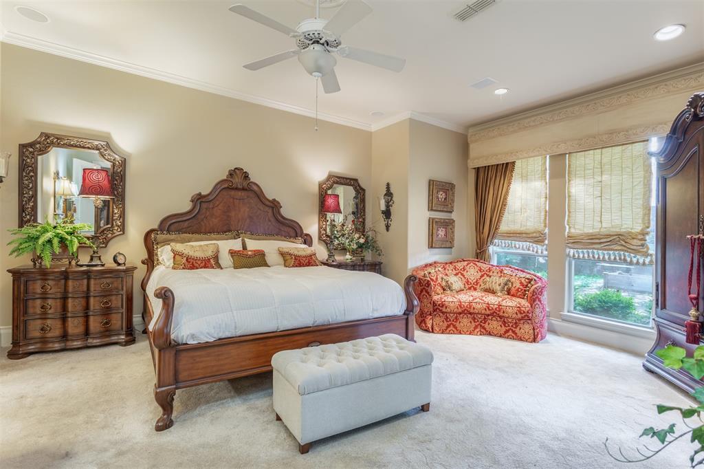 3401 Francesca Court Rowlett, TX 75088 - Photo 8 of 13 a bedroom with a bed and a chandelier