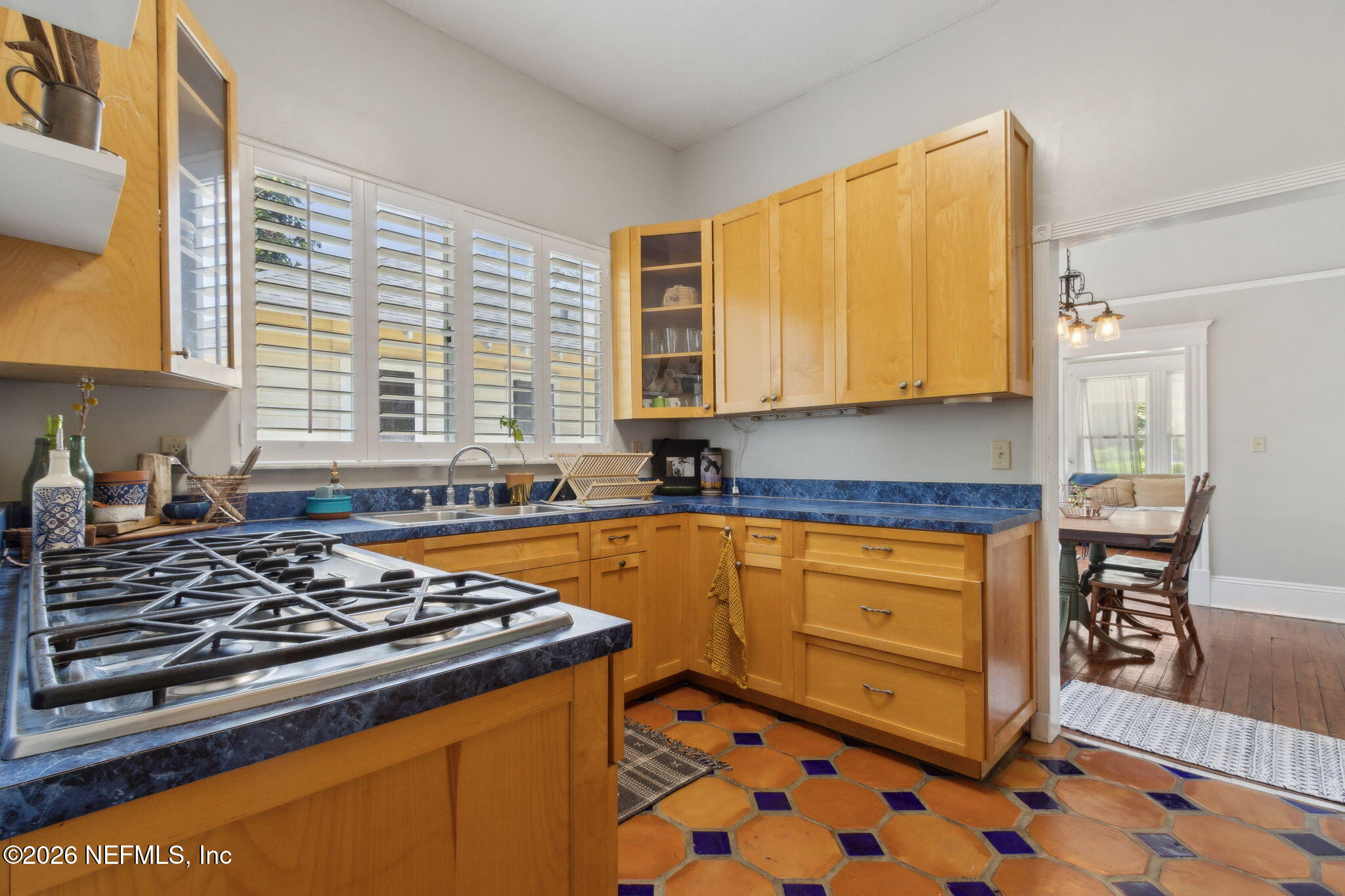 2974 Gilmore Street Jacksonville, FL 32205 - Photo 11 of 28 a kitchen with stainless steel appliances granite countertop a stove a sink and a microwave