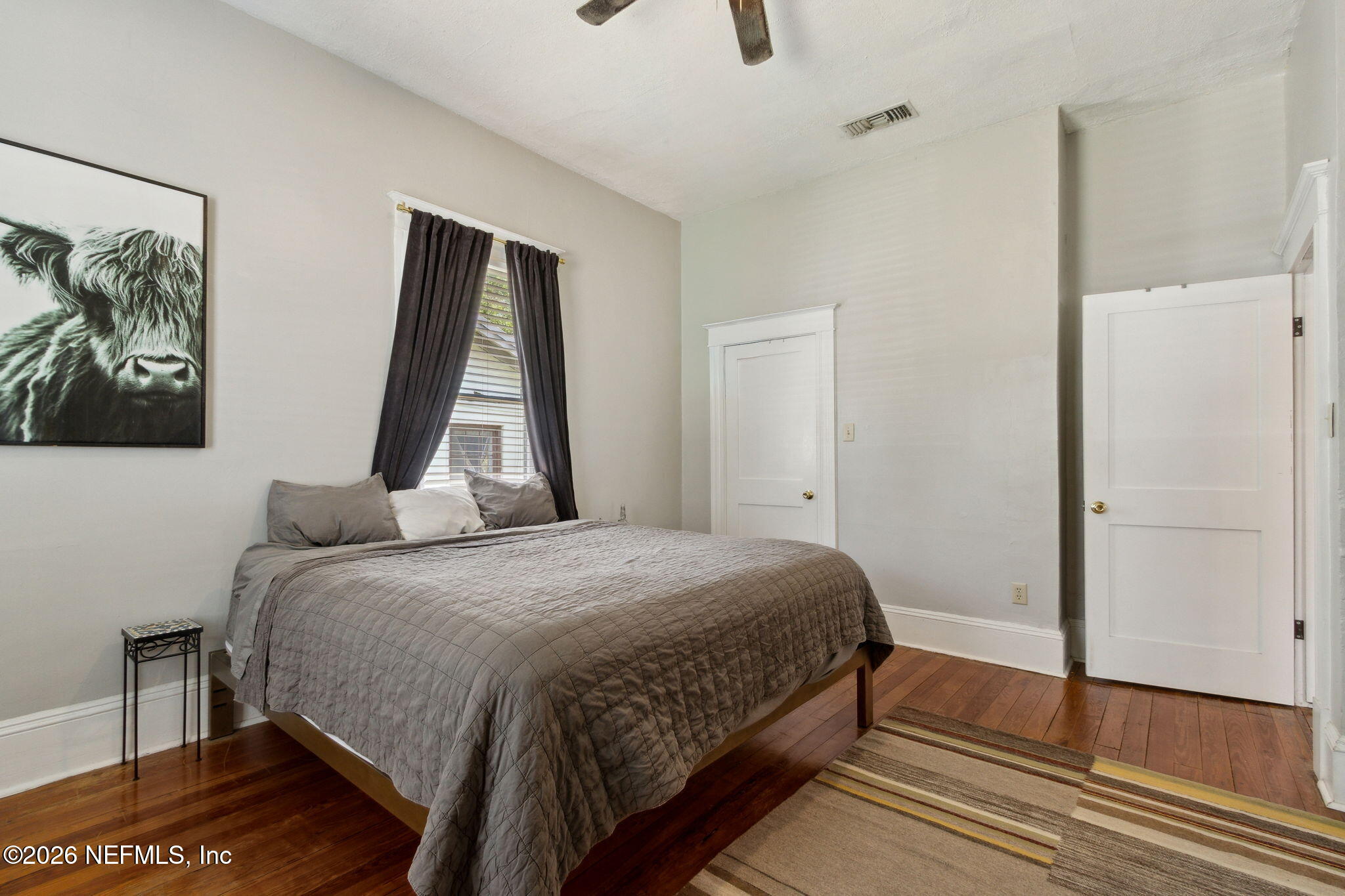 2974 Gilmore Street Jacksonville, FL 32205 - Photo 16 of 28 a bedroom with a bed and a flat screen tv