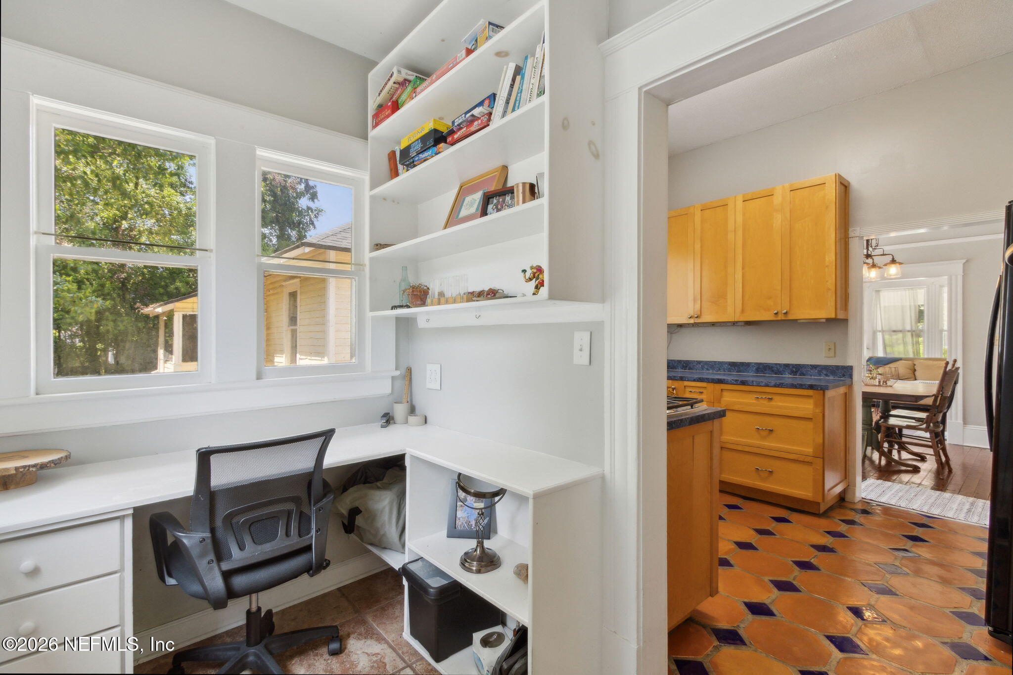 2974 Gilmore Street Jacksonville, FL 32205 - Photo 21 of 28 a workspace with kitchen island a window a counter space and a sink