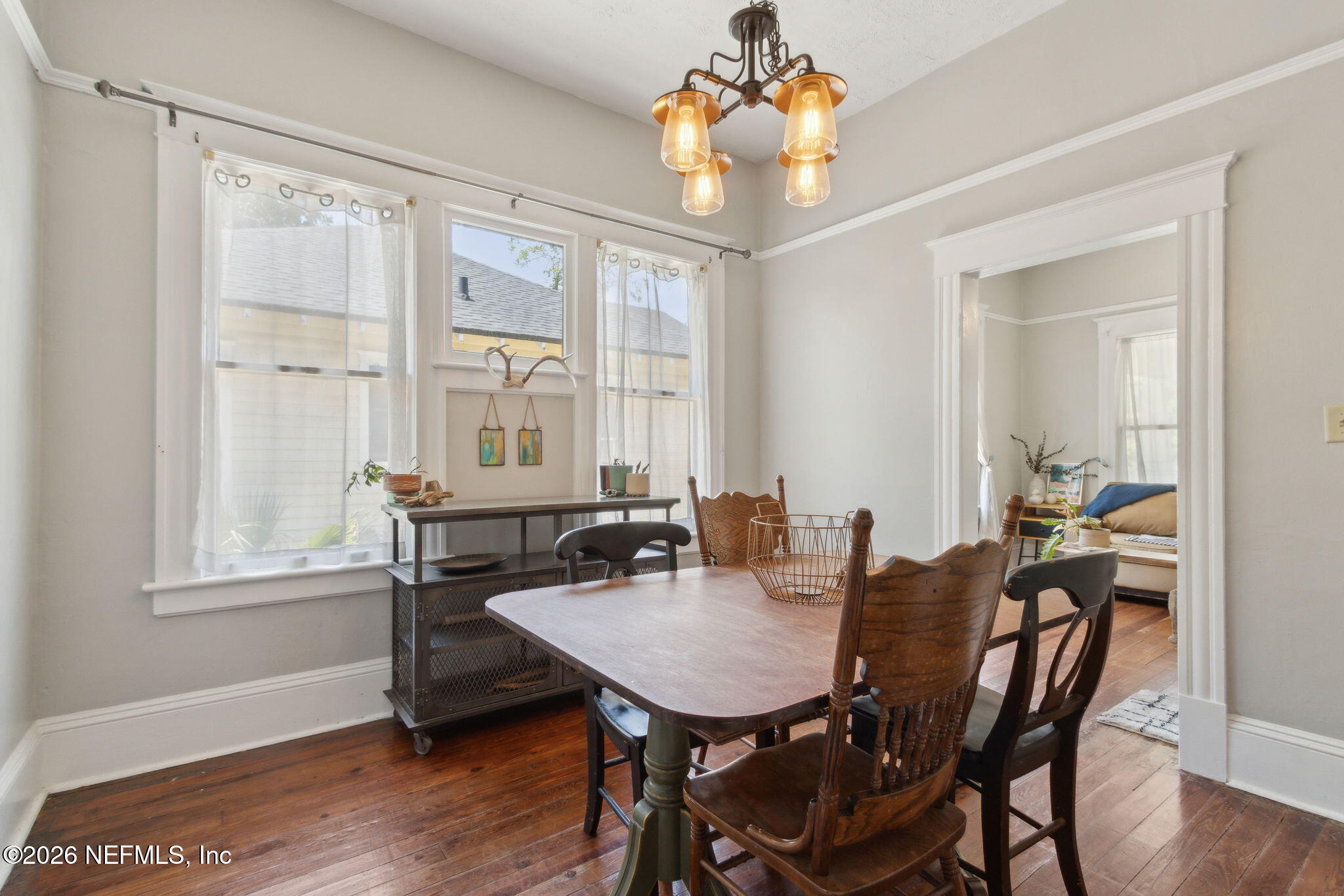 2974 Gilmore Street Jacksonville, FL 32205 - Photo 7 of 28 a view of a dining room with furniture window and wooden floor