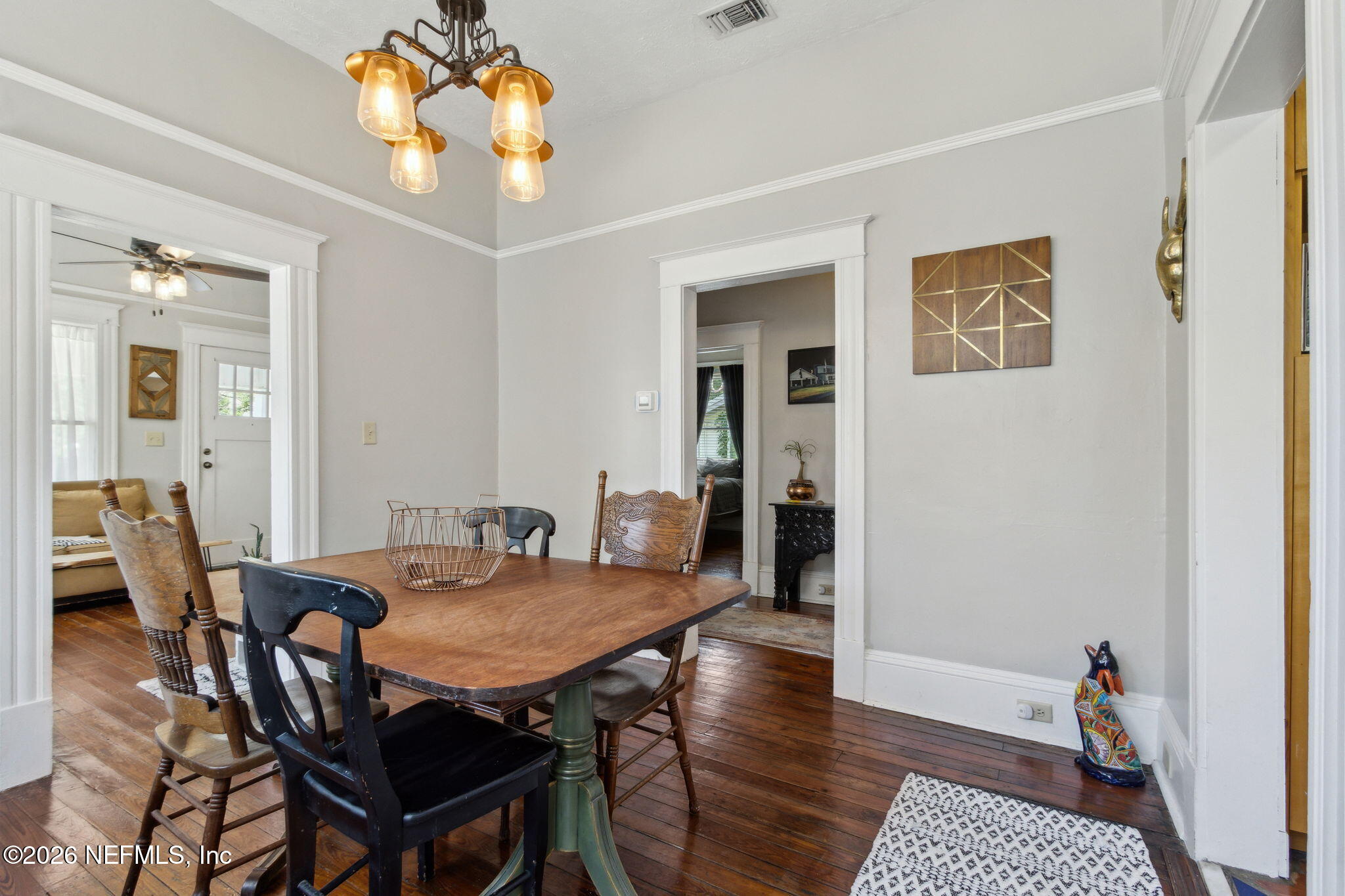 2974 Gilmore Street Jacksonville, FL 32205 - Photo 8 of 28 a view of a dining room with furniture and wooden floor