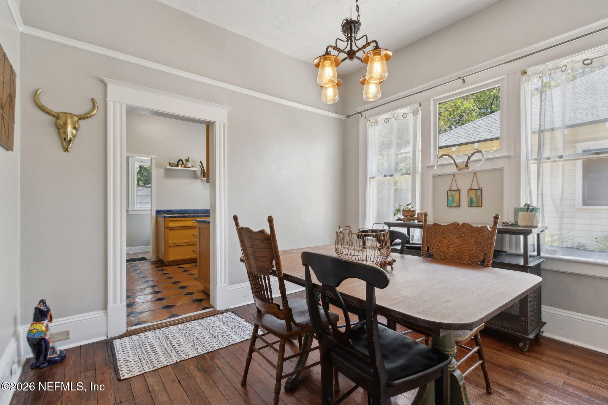2974 Gilmore Street Jacksonville, FL 32205 - Photo 9 of 28 a view of a dining room with furniture window and wooden floor