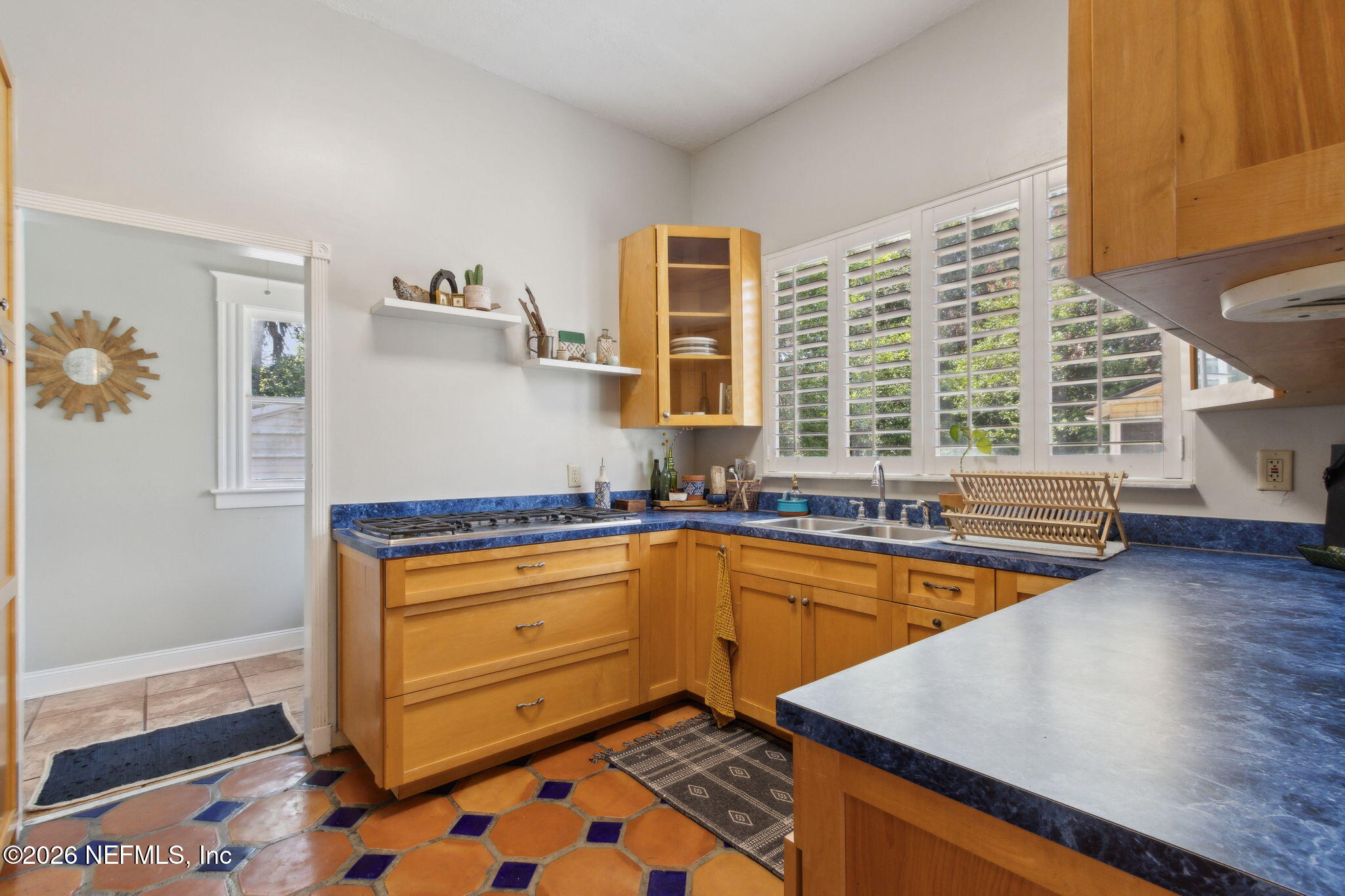 2974 Gilmore Street Jacksonville, FL 32205 - Photo 10 of 28 a kitchen with granite countertop a sink and a stove