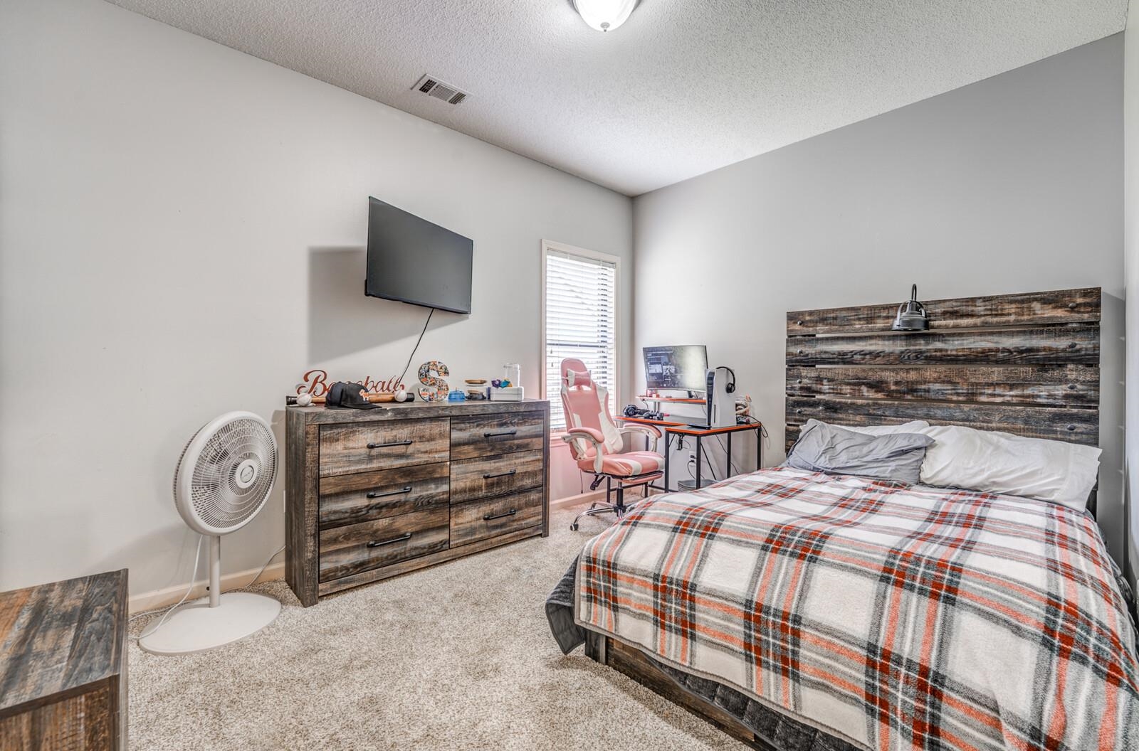 4671 Hampton Ridge Lane Bartlett, TN 38002 - Photo 27 of 40 Carpeted bedroom featuring neutral wall tones, a window with blinds, and a ceiling light fixture
