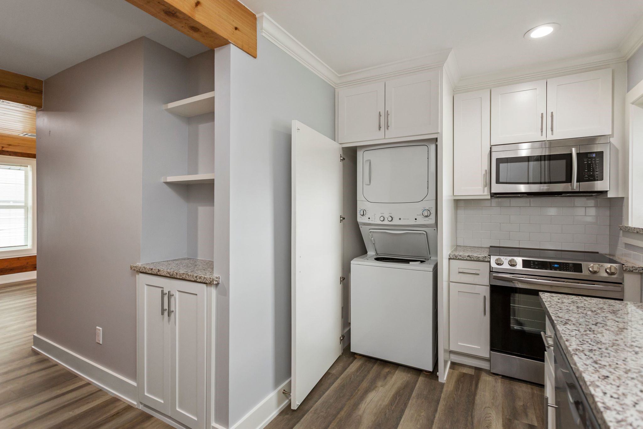 2005 Portsmouth Street, Unit B Houston, TX 77098 - Photo 15 of 24 a kitchen with a refrigerator and a stove top oven