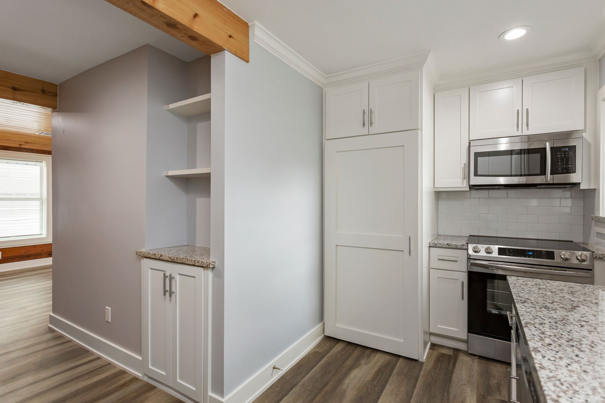 2005 Portsmouth Street, Unit B Houston, TX 77098 - Photo 16 of 24 a kitchen with a refrigerator and a stove top oven