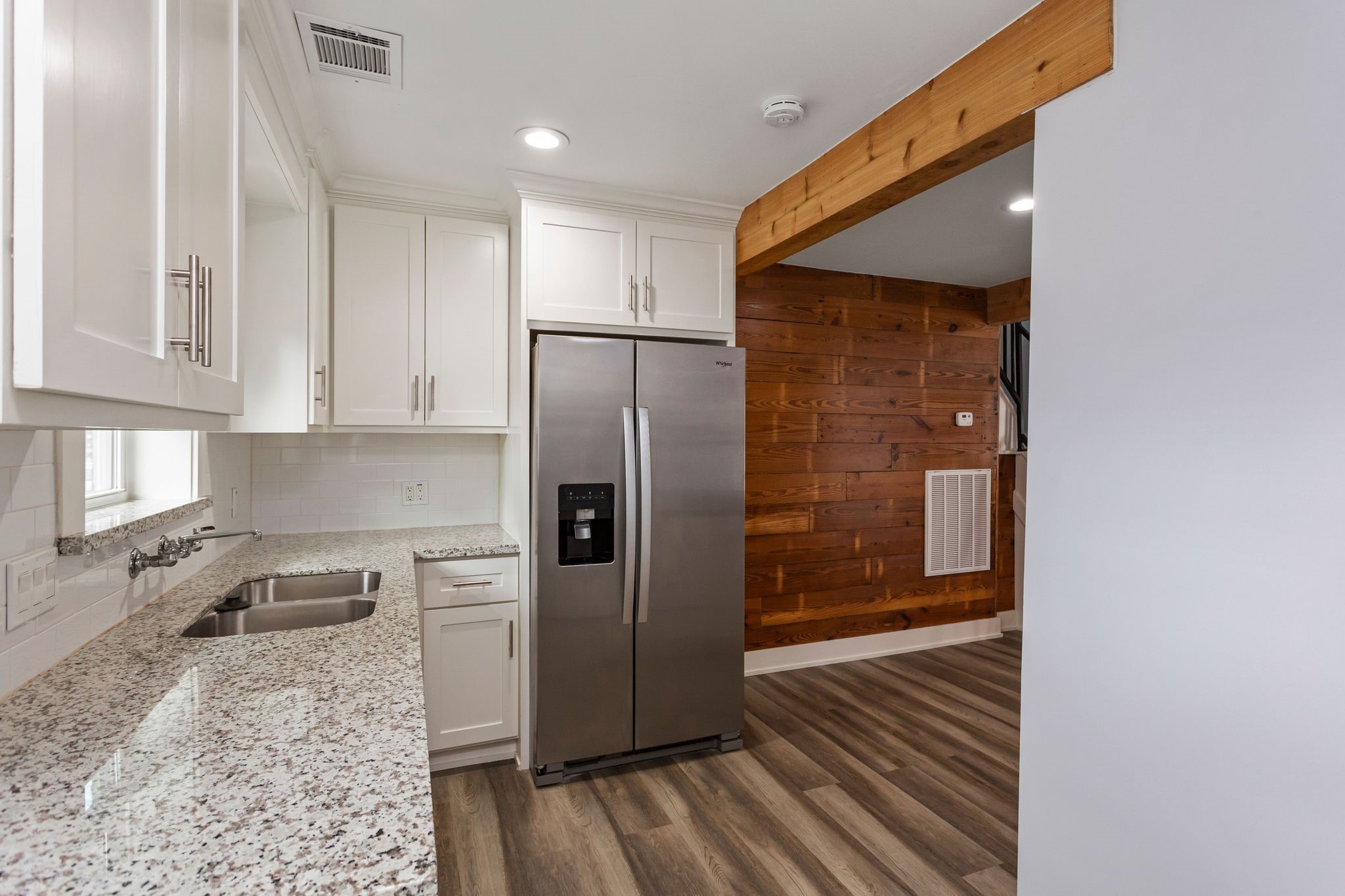 2005 Portsmouth Street, Unit B Houston, TX 77098 - Photo 17 of 24 a kitchen with stainless steel appliances granite countertop a refrigerator and a sink
