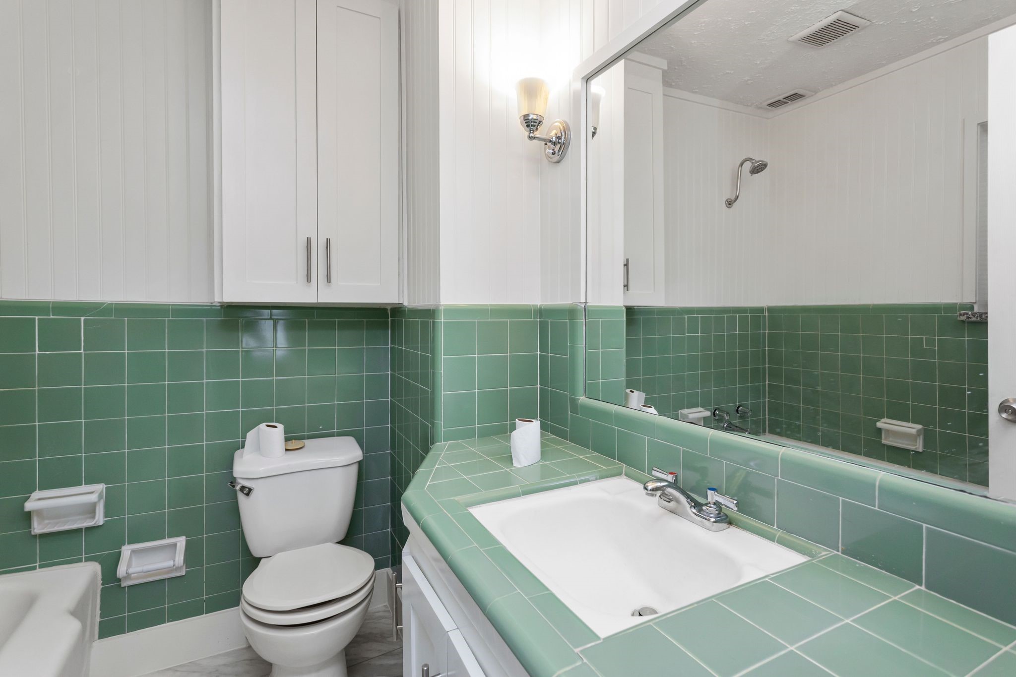 2005 Portsmouth Street, Unit B Houston, TX 77098 - Photo 18 of 24 a bathroom with a toilet a sink and mirror