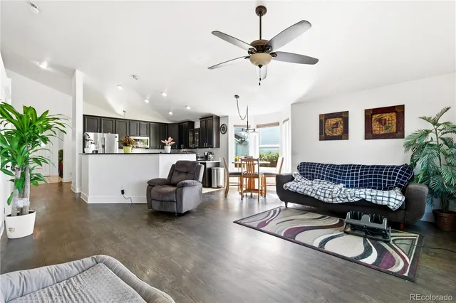 a living room with furniture and a chair