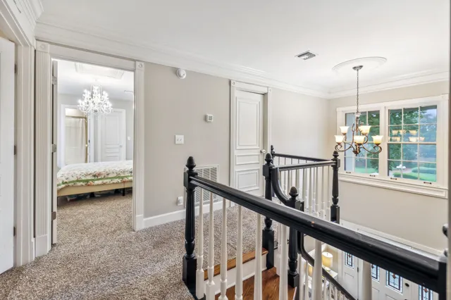 a view of a bedroom with furniture and windows