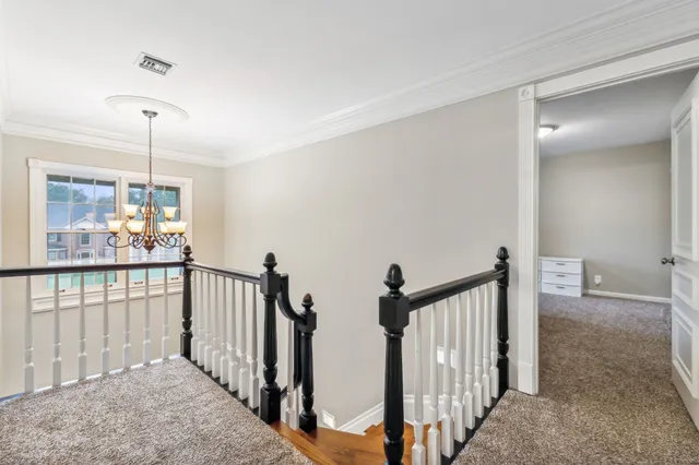 an empty room with closet and mirror