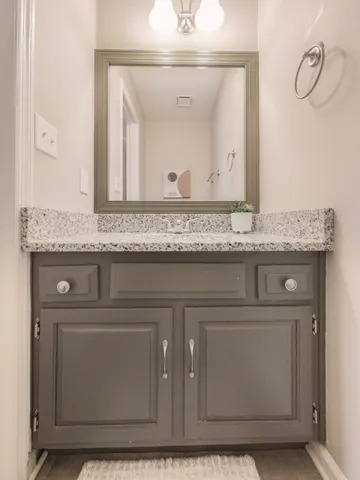 a view of staircase with white walls and a window