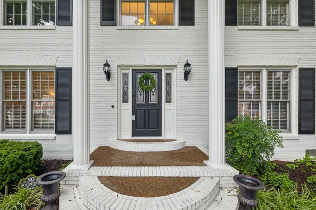 a bathroom with a granite countertop tub and shower