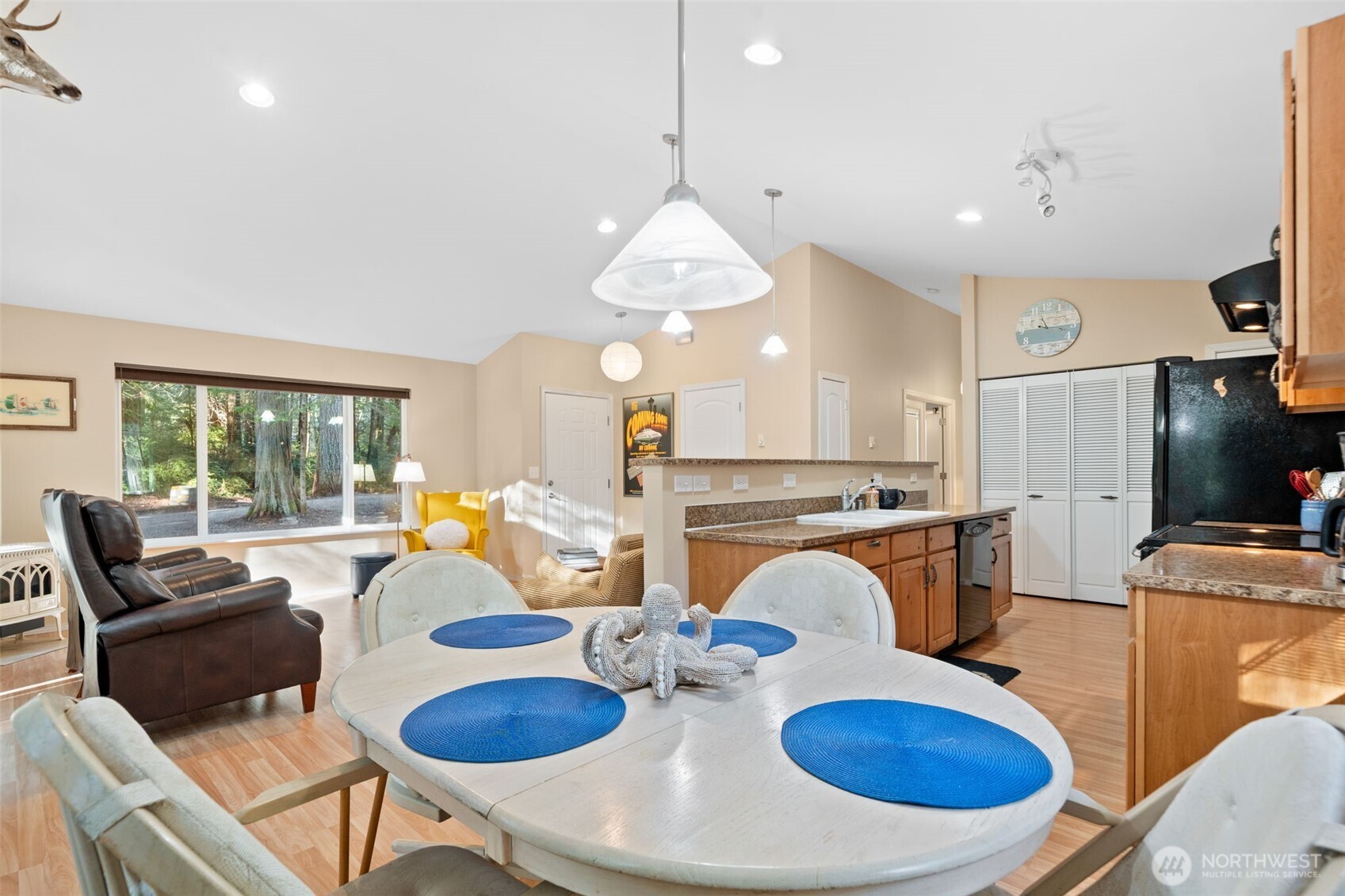 664 East Portage Road Shelton, WA 98584 - Photo 12 of 40 a living room with furniture a fireplace and a chandelier