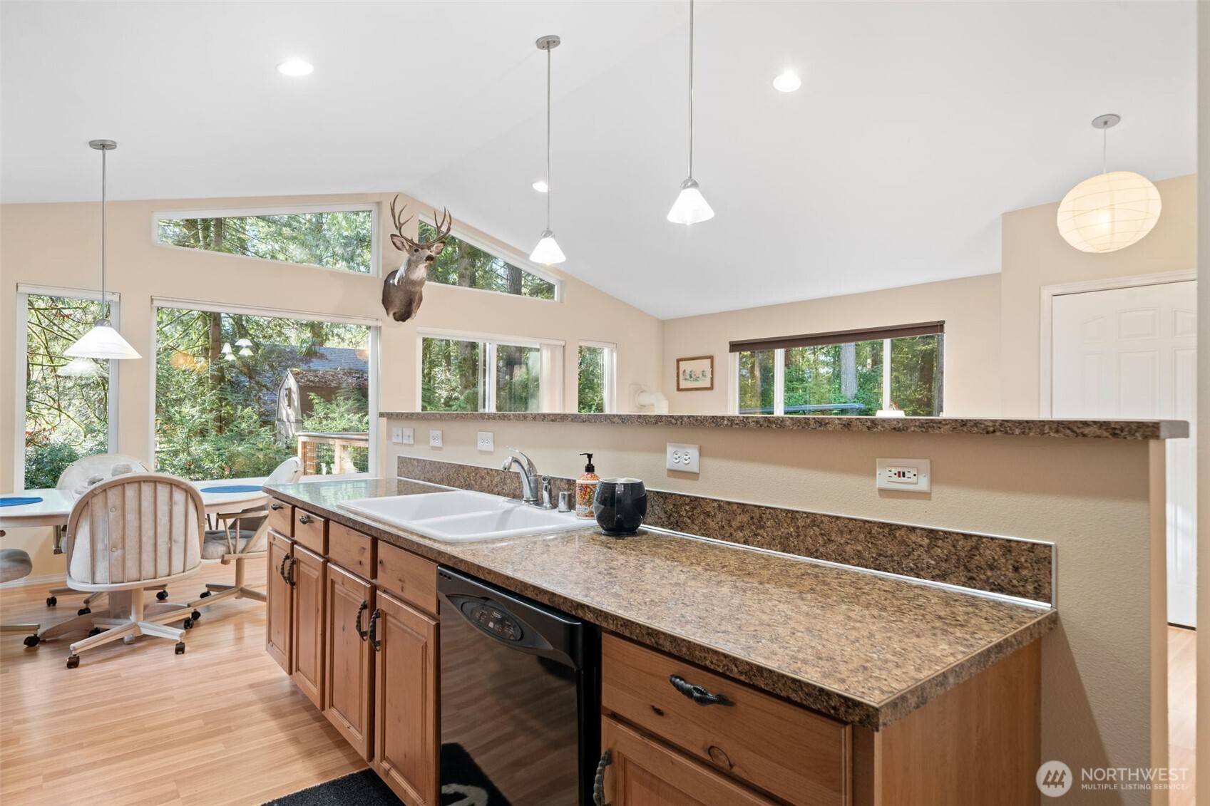 664 East Portage Road Shelton, WA 98584 - Photo 16 of 40 a kitchen with a sink a counter top space and a window