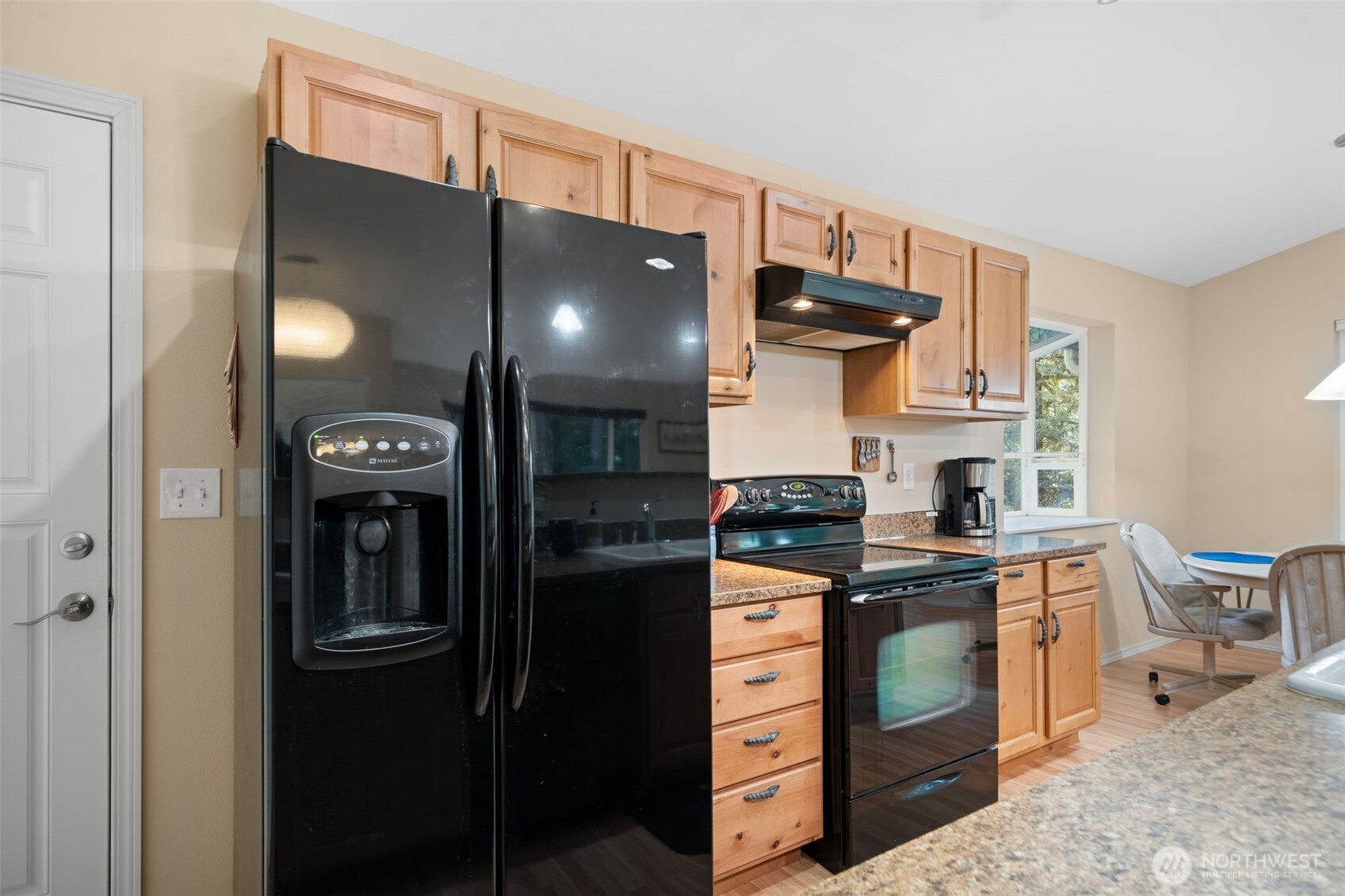 664 East Portage Road Shelton, WA 98584 - Photo 18 of 40 a kitchen with stainless steel appliances granite countertop a stove a sink and a refrigerator
