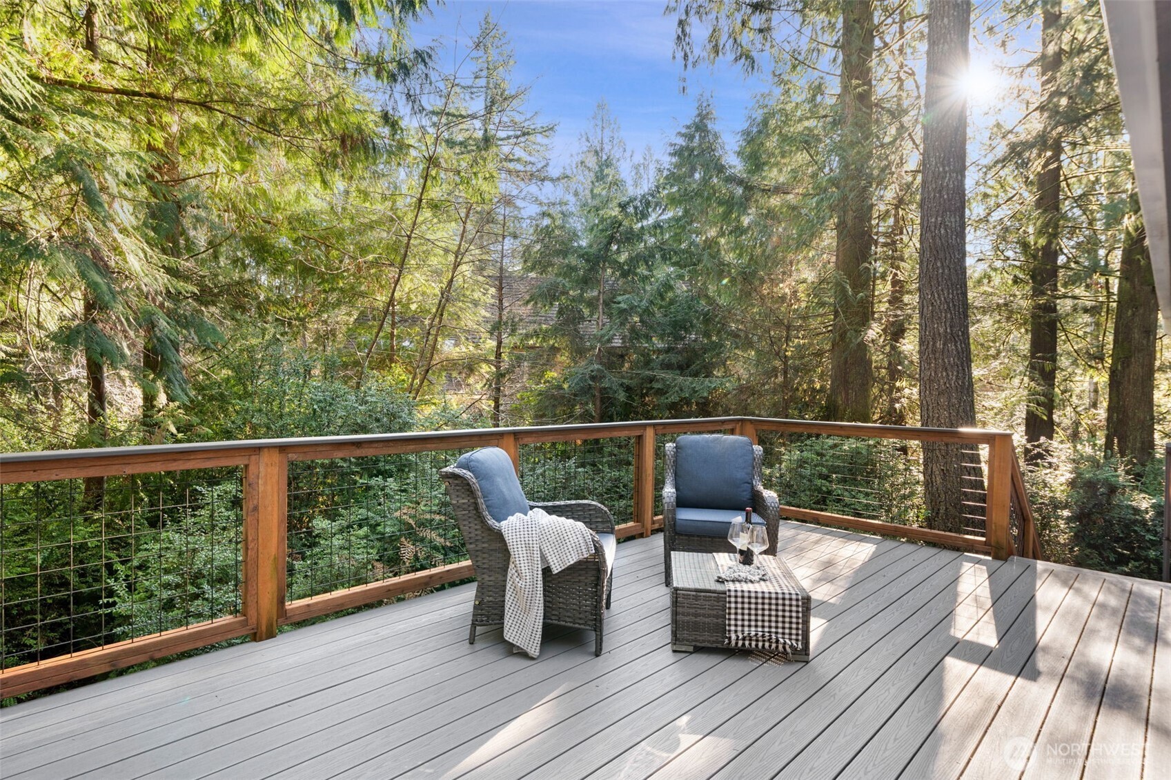 664 East Portage Road Shelton, WA 98584 - Photo 19 of 40 a balcony with wooden floor table and chairs