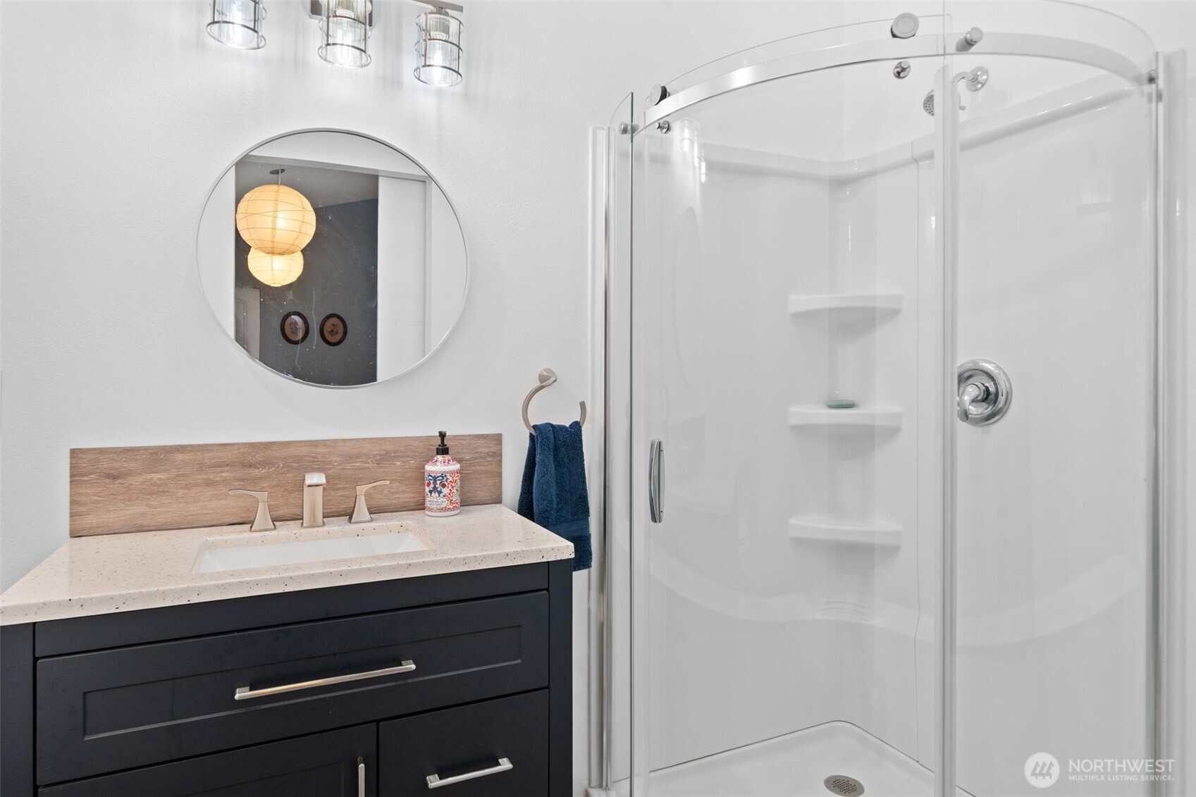 664 East Portage Road Shelton, WA 98584 - Photo 26 of 40 a bathroom with a sink mirror and a shower