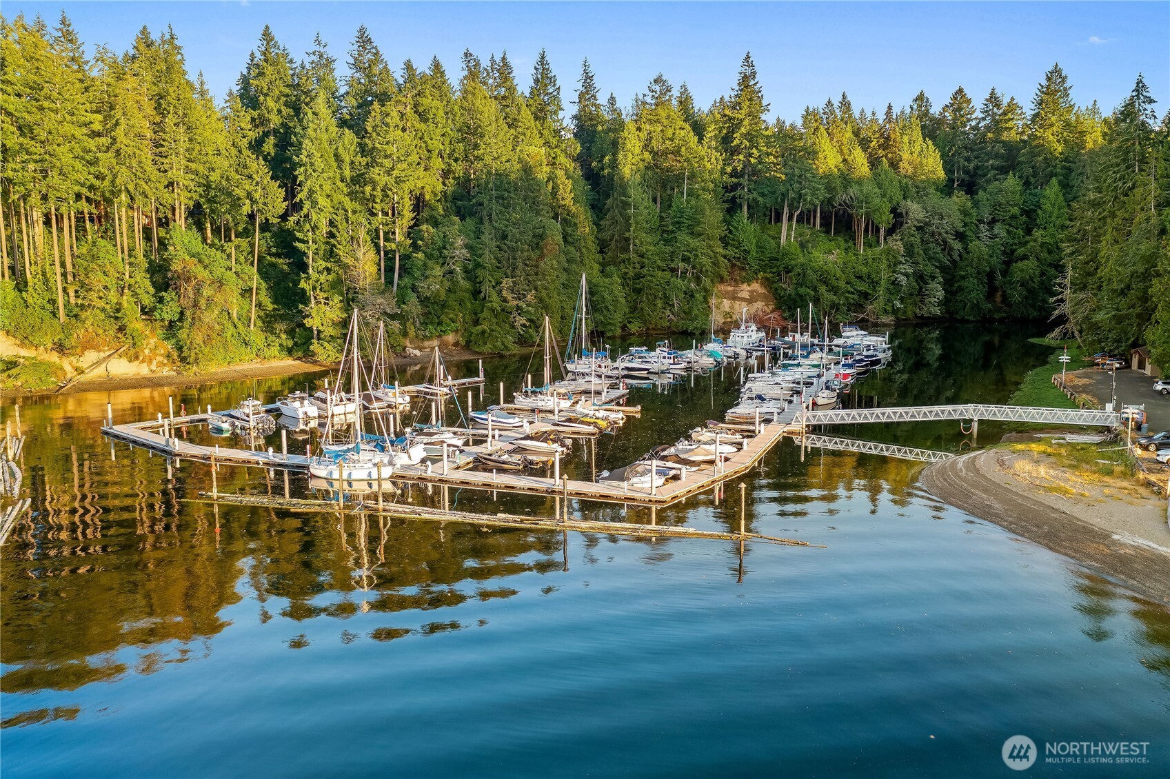 664 East Portage Road Shelton, WA 98584 - Photo 37 of 40 a view of a swimming pool with an outdoor space and seating area