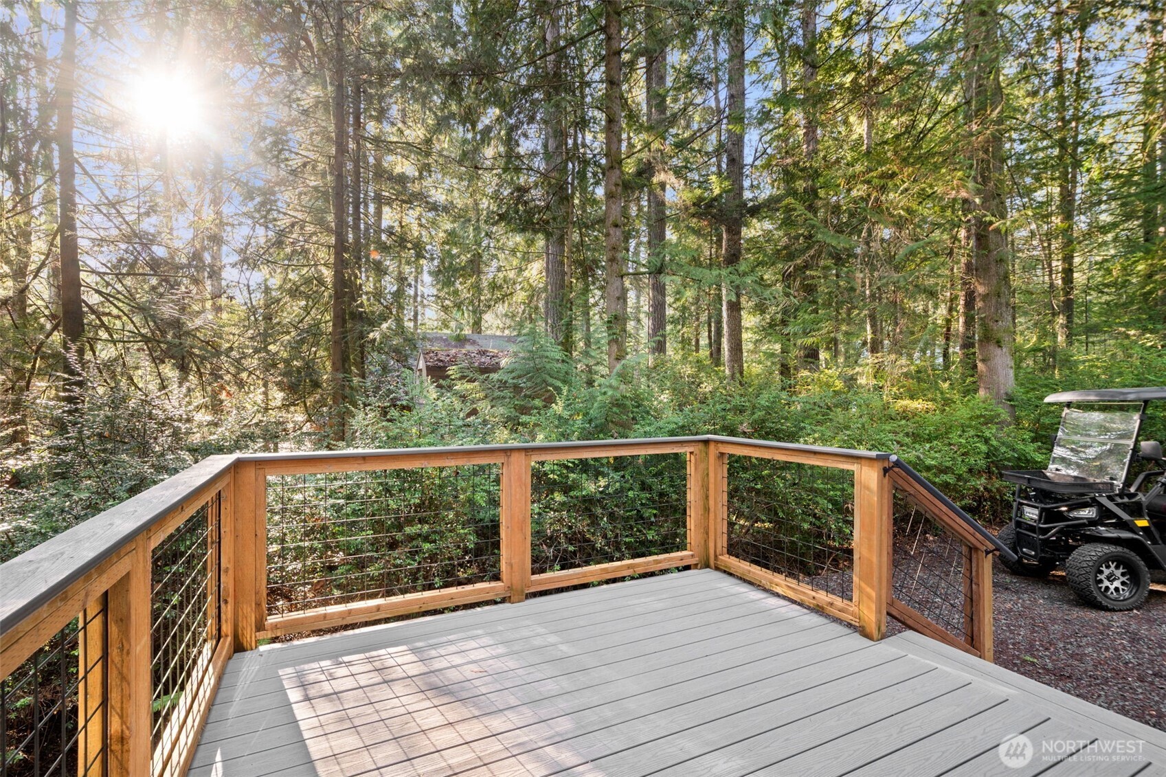 664 East Portage Road Shelton, WA 98584 - Photo 6 of 40 a view of a balcony with wooden floor and fence