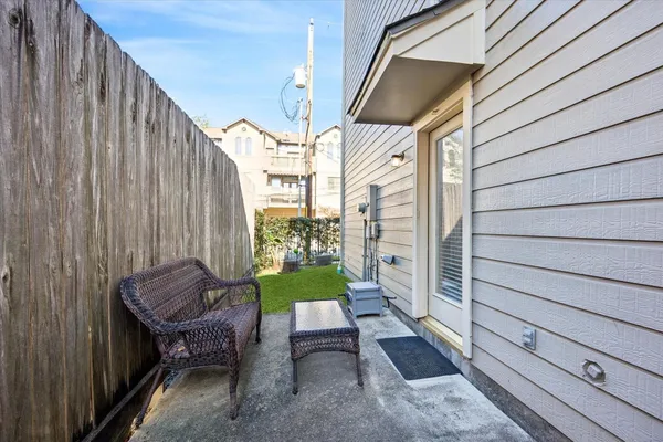a view of two chairs in the balcony