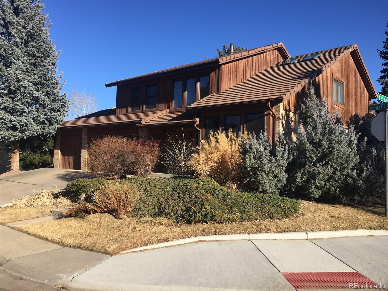 8148 Sweet Water Road Lone Tree, CO 80124 - Photo 1 of 13 a view of a house with a yard