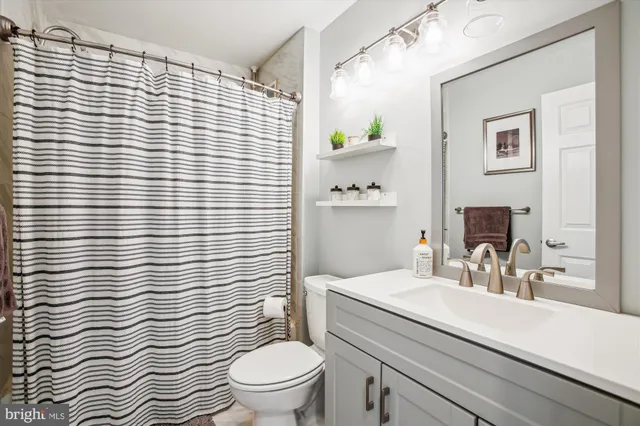 a bedroom with a bed and a desk