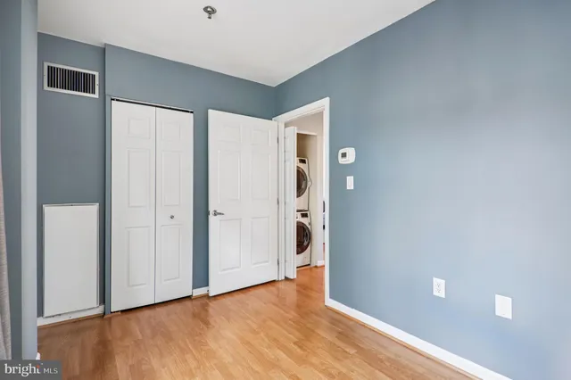 a view of a hallway with washer and dryer
