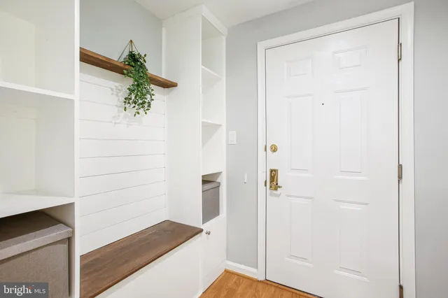 a kitchen with appliances a sink and cabinets