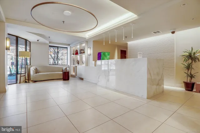 a view of a building with a bench in front of building