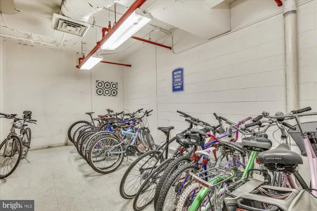 a patio with table and chairs and potted plants