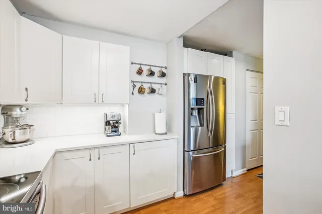 a kitchen with refrigerator and window
