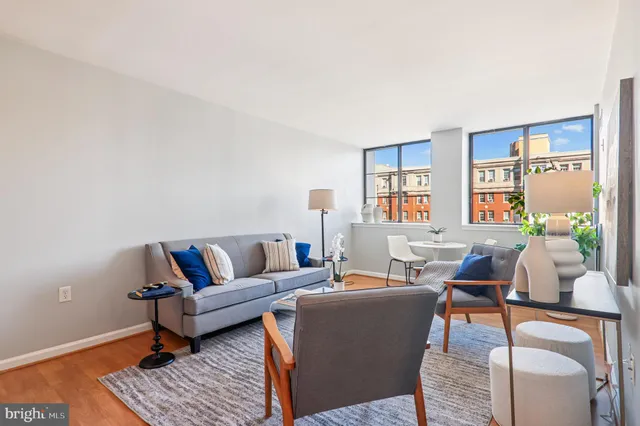 a living room with furniture and a table