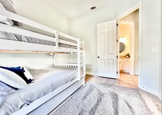 a bedroom with a bed and walk in closet