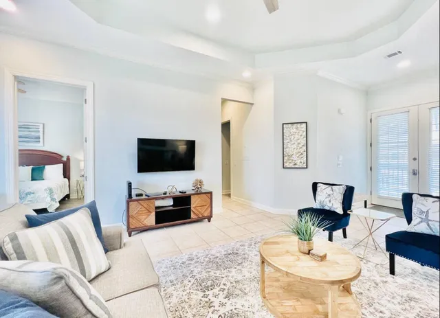 a living room with furniture and a flat screen tv