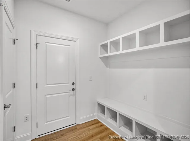 a view of house with wooden floor and white walls