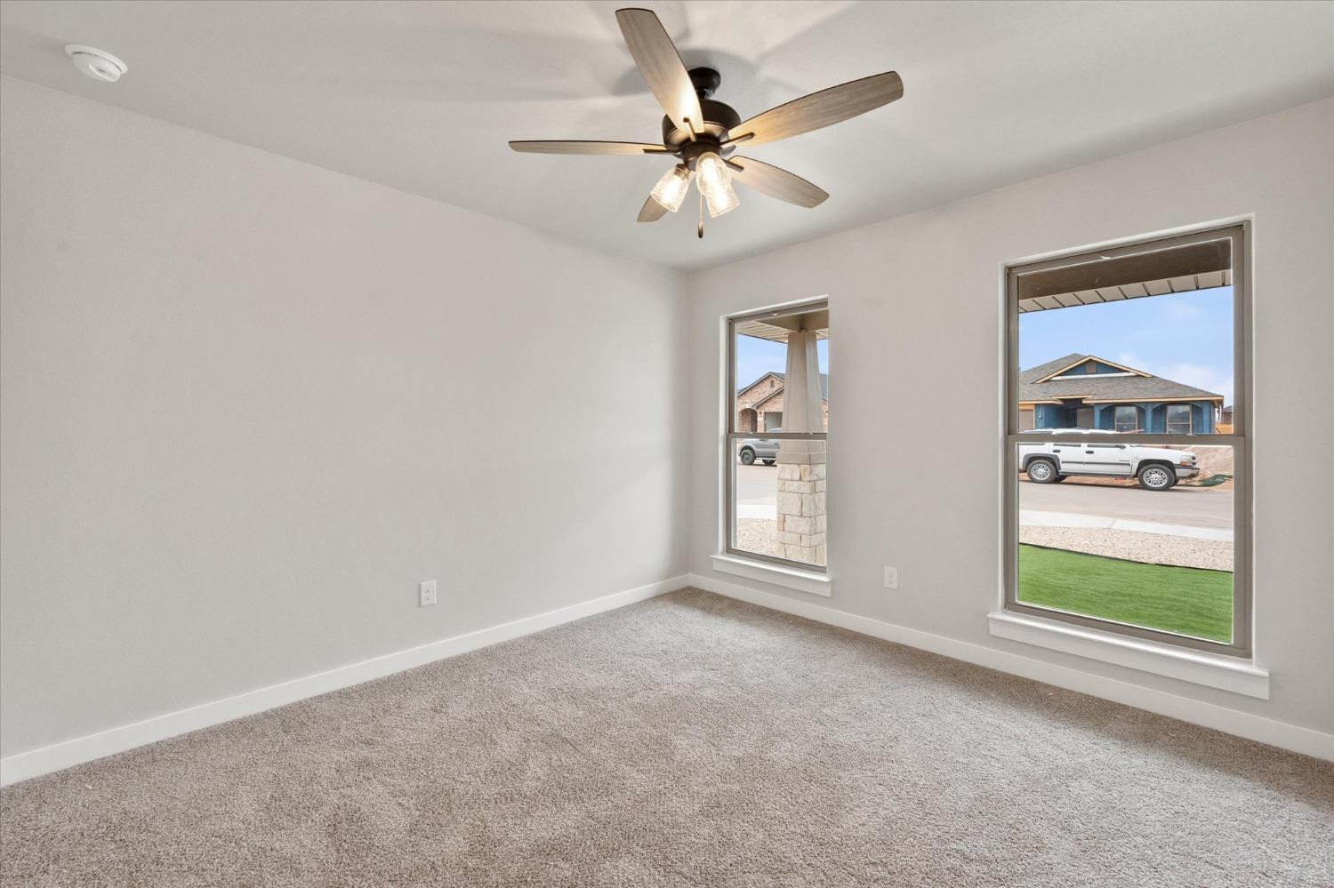 7435 29th Street Lubbock, TX 79407 - Photo 18 of 22 an empty room with windows and fan