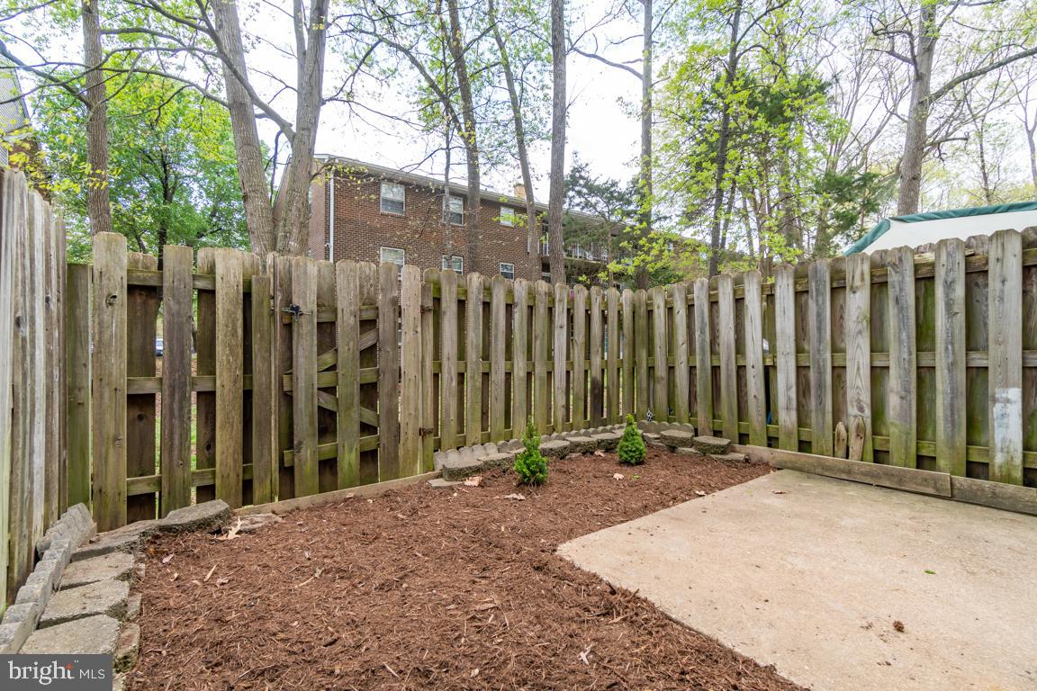 431 Greenbrier Ct., Unit 431 Fredericksburg, VA 22401 - Photo 46 of 49 Fenced in yard with patio