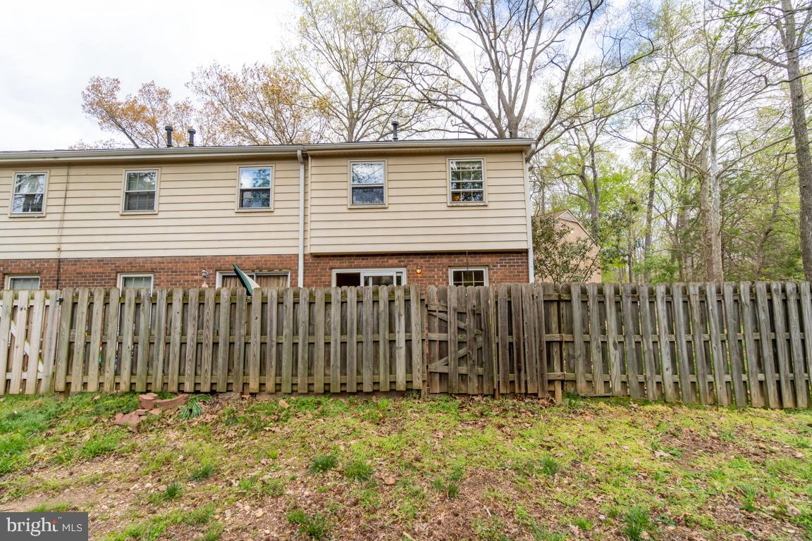 431 Greenbrier Ct., Unit 431 Fredericksburg, VA 22401 - Photo 47 of 49 rear view of home and privacy in the back
