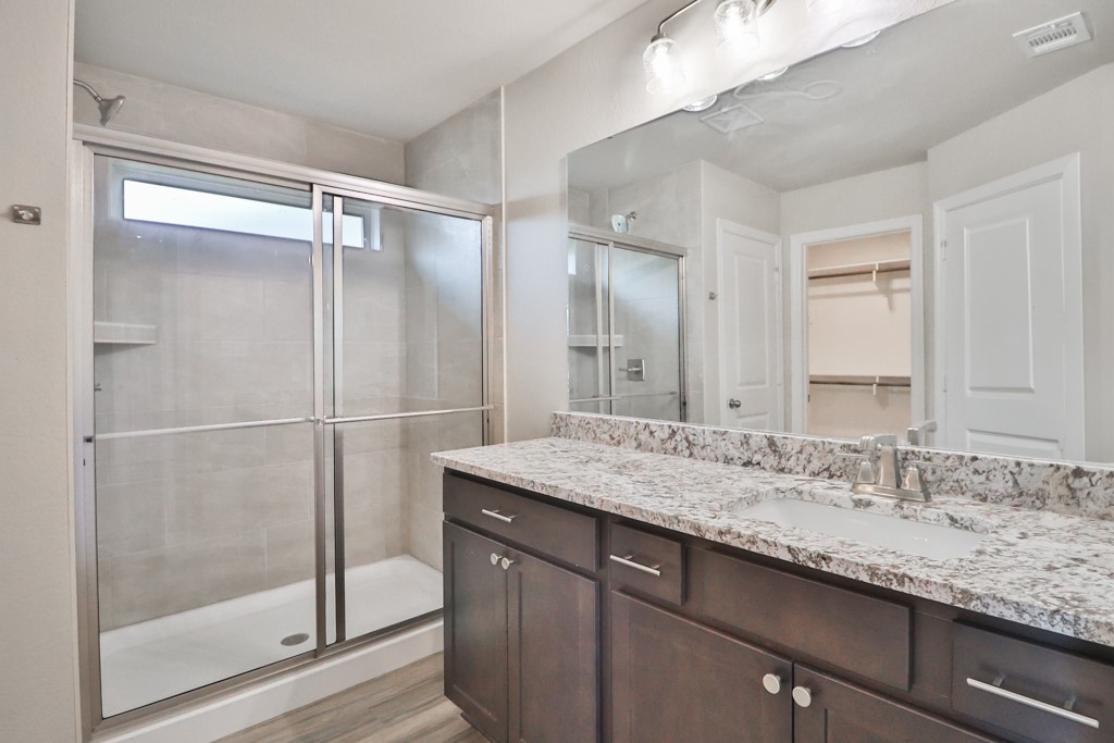 2871 Messenger Way Bryan, TX 77803 - Photo 8 of 13 a bathroom with a granite countertop sink mirror and double