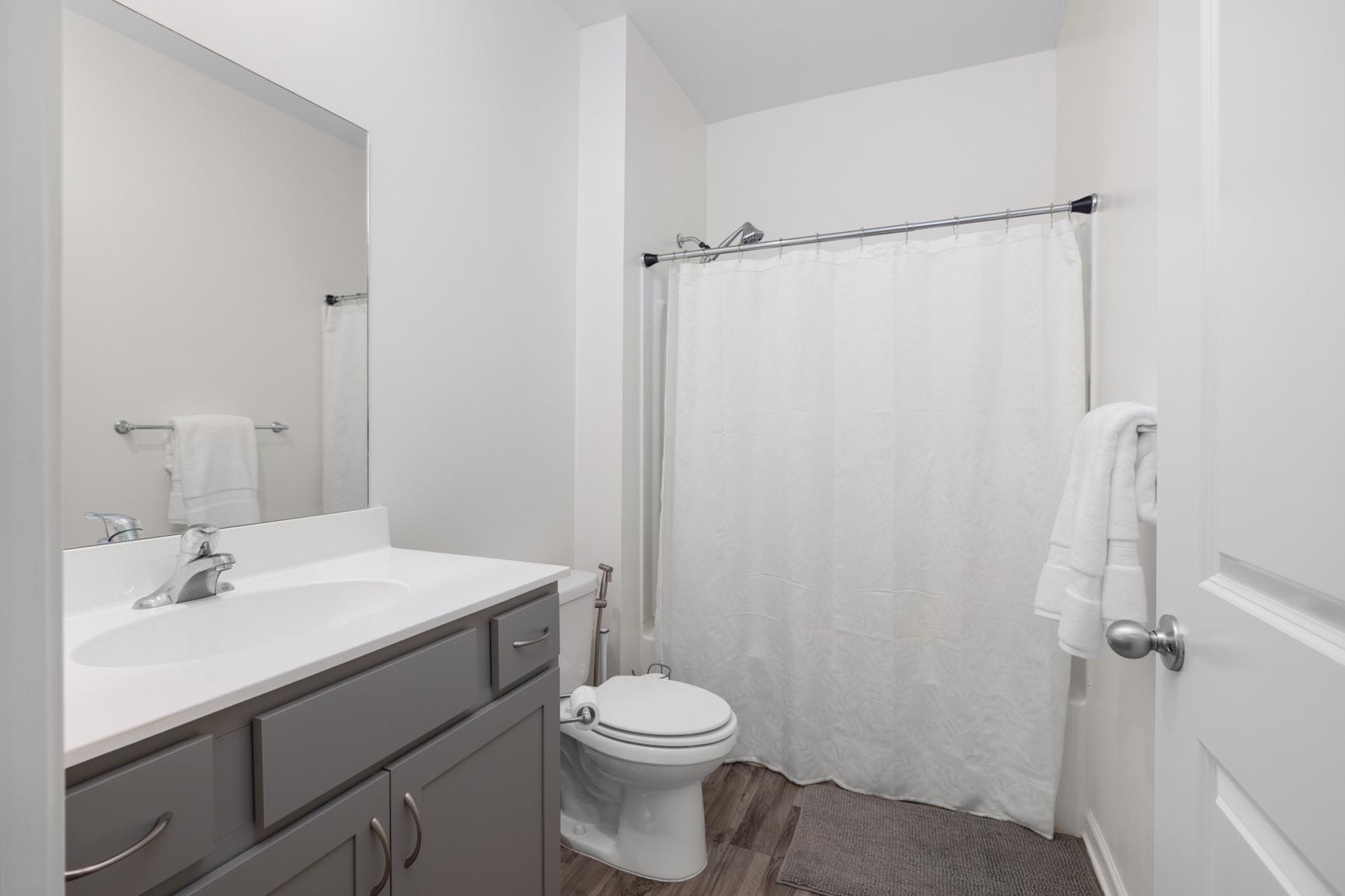 5132 Shellback Drive Millington, TN 38053 - Photo 19 of 24 a bathroom with a sink a toilet and shower