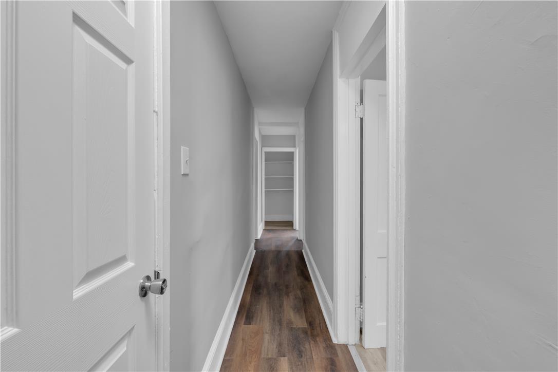 149 West Ridge Street, Unit 1B Lansford, PA 18232 - Photo 10 of 14 A long, inviting hallway with richly textured flooring guides the eye toward a convenient built-in storage area.