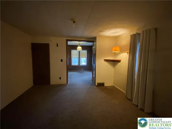 a view of a room with a hallway