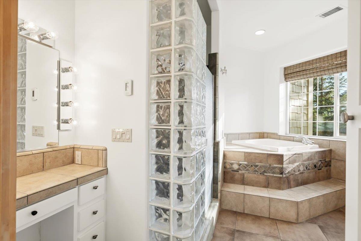 12531 Lowhills Road Nevada City, CA 95959 - Photo 37 of 92 a spacious bathroom with a tub sink and shower
