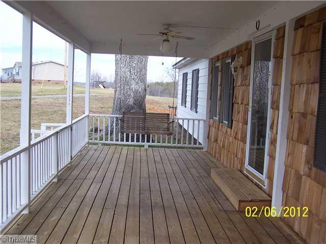 3802 Amostown Road Sandy Ridge, NC 27046 - Photo 3 of 16 Remarks. Large front porch with swing