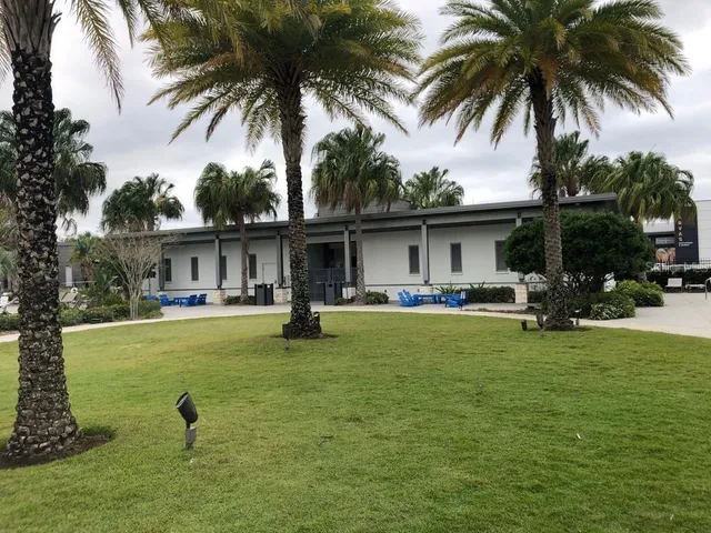 a front view of multiple houses with yard