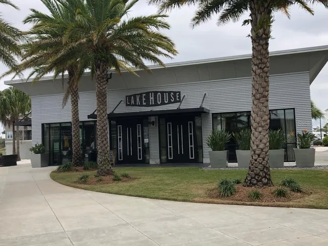 a gym room with gym equipment and a large window