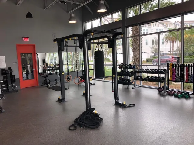 a swimming pool with outdoor seating and a garden